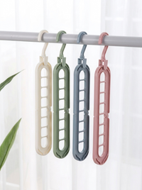 Four nine-hole hangers hanging vertically, showing the nine slots and rotating hook