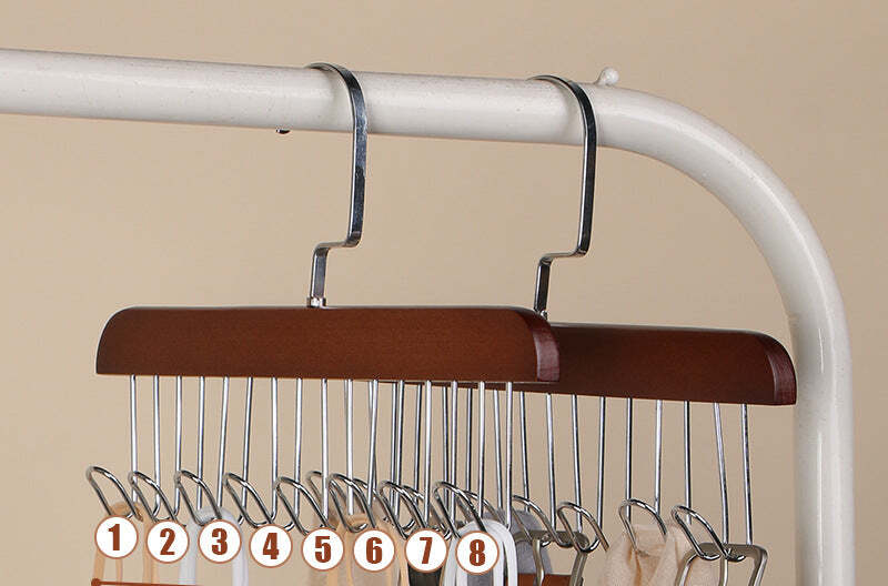 Solid wood eight-hook rack in retro brown, holding belts and straps