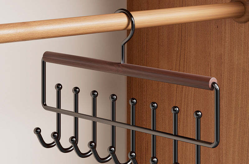 Beech and black wrought-iron eight-hook rack on a closet rail