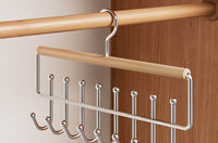 Beech and silver wrought-iron eight-hook rack on a closet rail